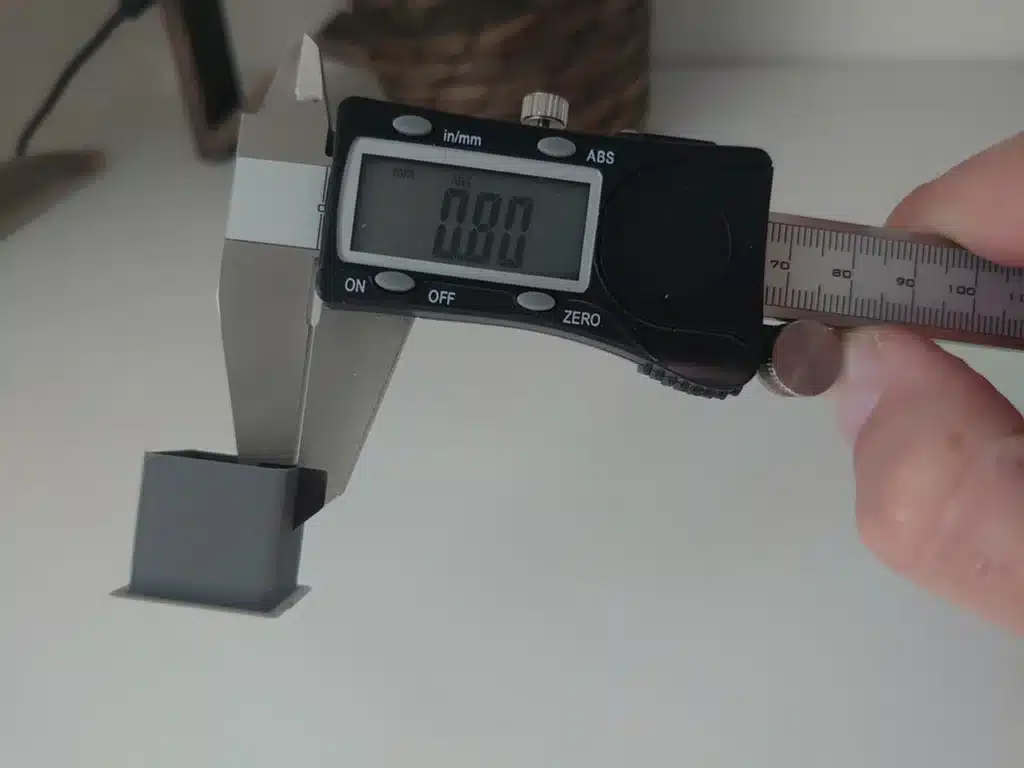 large_display_dsc_6747_81314 Digital caliper measuring a small rectangular object, displaying 0.00 on the screen, white background. | Sky Rye Design Digital caliper measuring a small rectangular object, displaying 0.00 on the screen, white background.