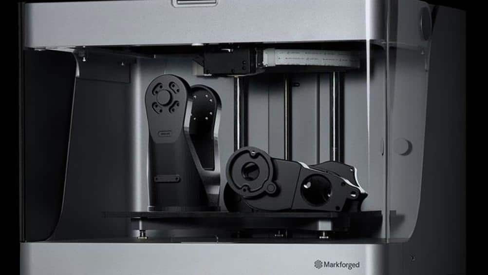 markforged-ecosystem-20from-20hk3d Industrial 3D printer by Markforged creating detailed black mechanical parts. | Sky Rye Design Industrial 3D printer by Markforged creating detailed black mechanical parts.