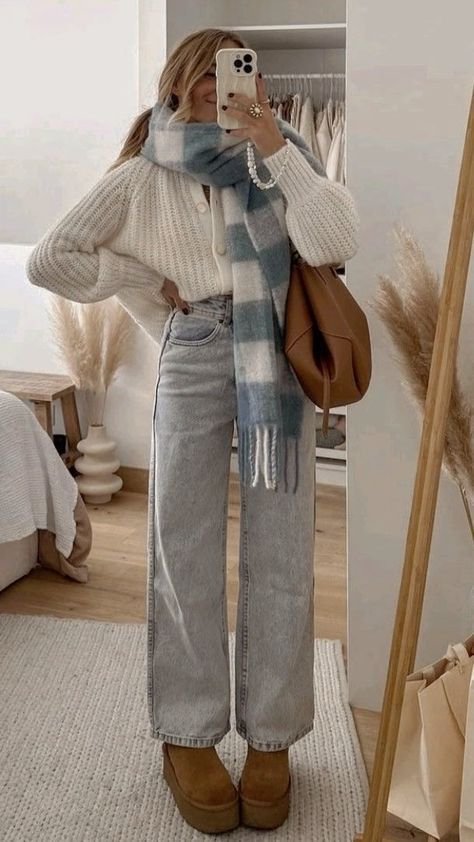 Cozy outfit with a chunky knit sweater, plaid scarf, high-waisted jeans, and platform boots in a stylish bedroom mirror selfie.