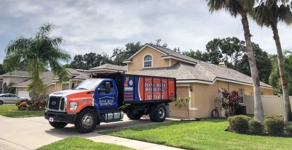 shingle-roofing-by-done-rite-roofing-3 Roofing truck parked in front of a suburban house with palm trees and blue sky. | Sky Rye Design Roofing truck parked in front of a suburban house with palm trees and blue sky.