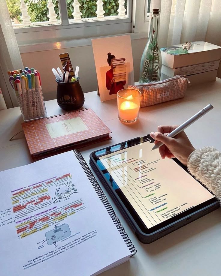 studying aesthetic biology major Cozy study desk with tablet notes, colorful pens, and a lit candle by the window. | Sky Rye Design Cozy study desk with tablet notes, colorful pens, and a lit candle by the window.