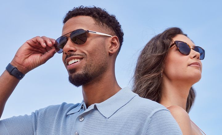 tinted_mobile_720x440_70786c9686 A stylish couple wearing sunglasses enjoying a sunny day under a clear blue sky. | Sky Rye Design A stylish couple wearing sunglasses enjoying a sunny day under a clear blue sky.