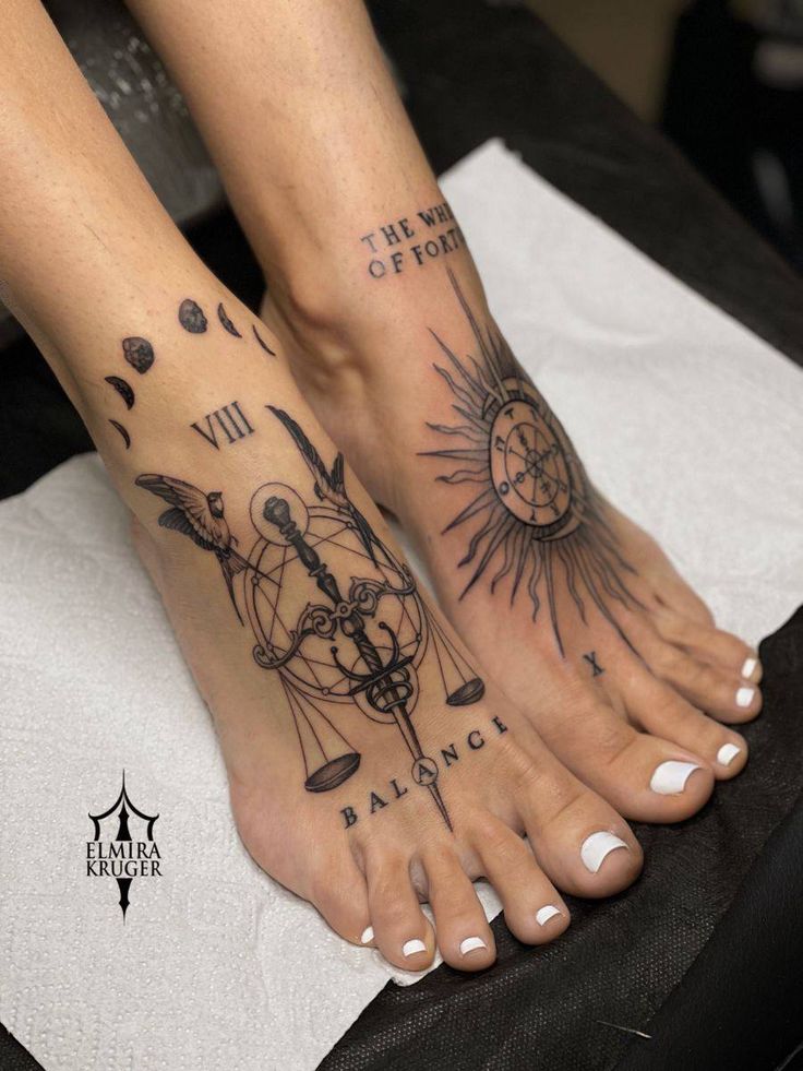_ Feet with celestial-themed tattoos, including moon phases, a balance scale, sun design, and The Wheel of Fortune text. | Sky Rye Design Feet with celestial-themed tattoos, including moon phases, a balance scale, sun design, and The Wheel of Fortune text.