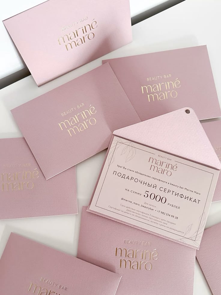 Pink gift certificates for a beauty bar named Mariné Maro, valued at 5000 rubles, with elegant design.