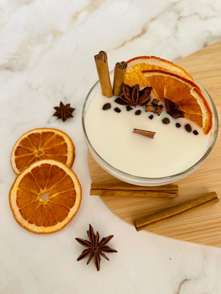 Свечи Creamy dessert with dried oranges, cinnamon sticks, and star anise on a marble surface. Cozy and aromatic treat. | Sky Rye Design Creamy dessert with dried oranges, cinnamon sticks, and star anise on a marble surface. Cozy and aromatic treat.