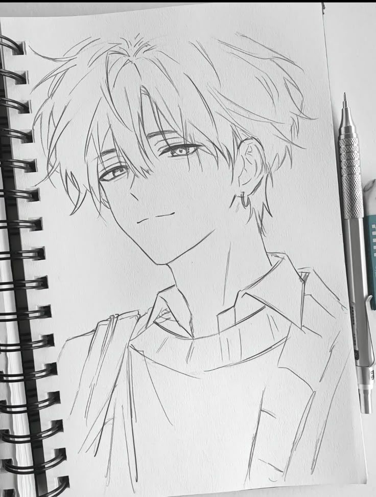 Anime sketch of a cool guy with tousled hair, drawn on a notepad with a mechanical pencil nearby.