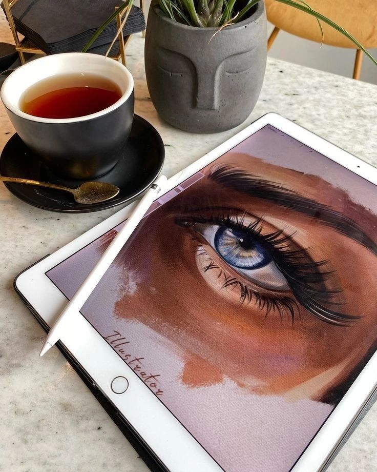 ыуекпфу Digital art of an eye on a tablet beside a cup of tea and a plant on a marble table. | Sky Rye Design Digital art of an eye on a tablet beside a cup of tea and a plant on a marble table.