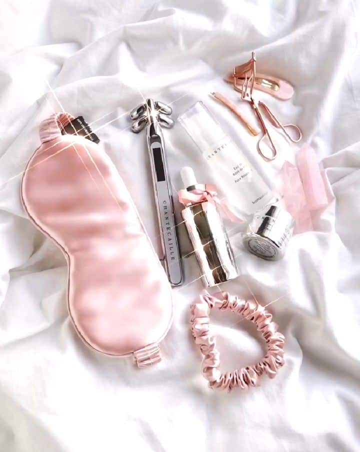 💖 Luxury skincare and beauty essentials on white background, featuring a pink sleep mask, serum, cream, and beauty tools for a pampering routine. | Sky Rye Design Luxury skincare and beauty essentials on white background, featuring a pink sleep mask, serum, cream, and beauty tools for a pampering routine.