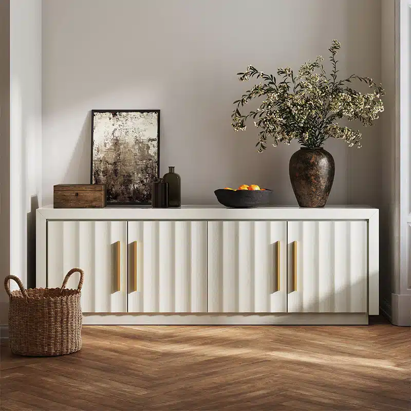 014-HG-41034-WS_01d Modern sideboard with decor: basket, artwork, and vase with flowers on wood flooring, against neutral wall. Contemporary home interior design. | Sky Rye Design Modern sideboard with decor: basket, artwork, and vase with flowers on wood flooring, against neutral wall. Contemporary home interior design.