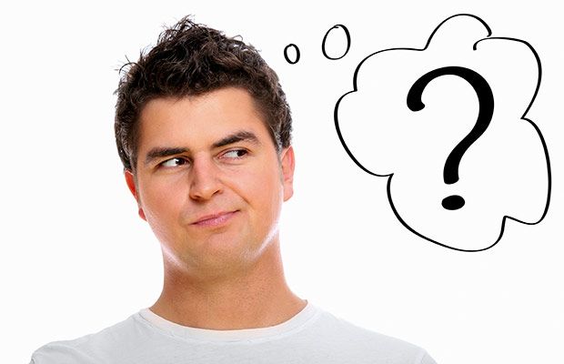 Man with curious expression looking at a question mark thought bubble, symbolizing uncertainty or decision-making.