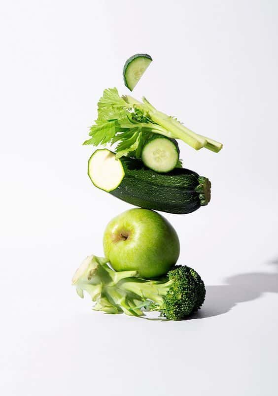 _ 11 Stacked green vegetables and fruits: cucumber, celery, zucchini, apple, and broccoli on a white background. | Sky Rye Design Stacked green vegetables and fruits: cucumber, celery, zucchini, apple, and broccoli on a white background.