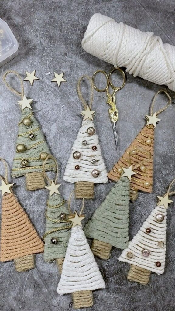 11 Christmas activities you need to do this winter DIY twine Christmas tree ornaments with stars, bells, decorative string, and scissors on a gray surface. | Sky Rye Design DIY twine Christmas tree ornaments with stars, bells, decorative string, and scissors on a gray surface.