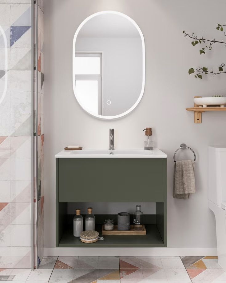 Modern bathroom vanity with mirror, green cabinet, and minimalist decor for stylish interior design.