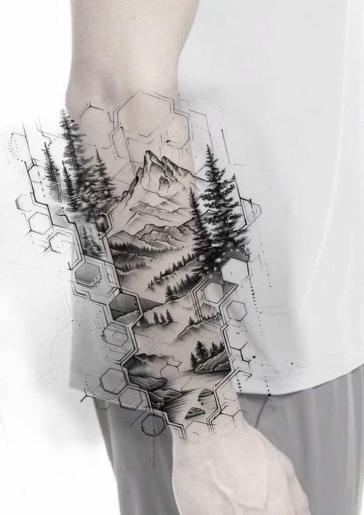 Geometric mountain and forest tattoo on forearm, featuring trees and hexagon patterns in black and white.