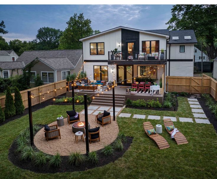 _ 13 Modern backyard with cozy seating, fire pit, outdoor lighting, and stylish patio in a suburban setting at dusk. | Sky Rye Design Modern backyard with cozy seating, fire pit, outdoor lighting, and stylish patio in a suburban setting at dusk.