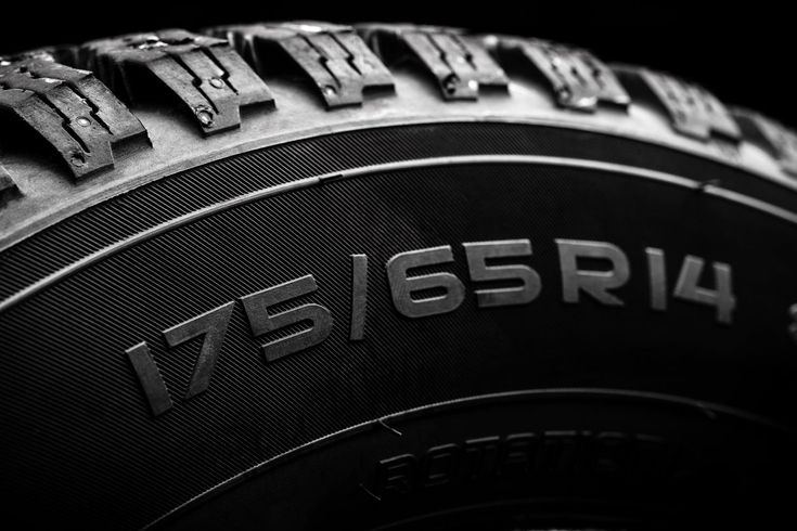 Close-up of a tire showcasing its size specifications: 175/65R14. Perfect for automotive and tire-related content.
