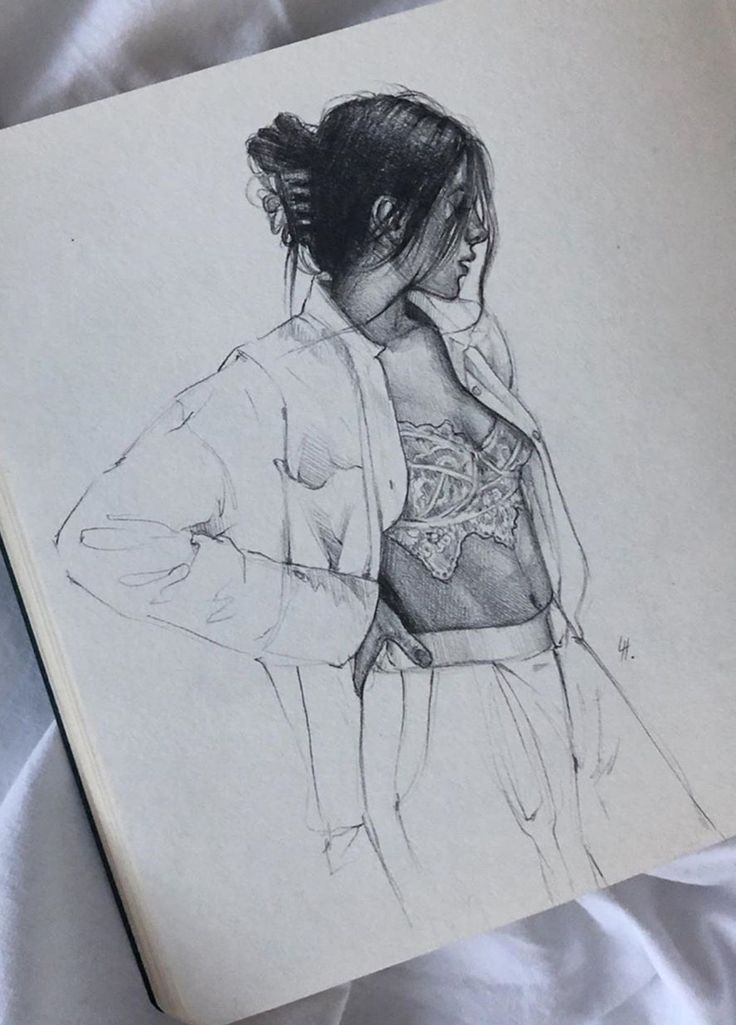 Sketch of a woman in a lace top and open shirt, hand on hip, captured in a minimalistic pencil drawing style on sketchbook paper.