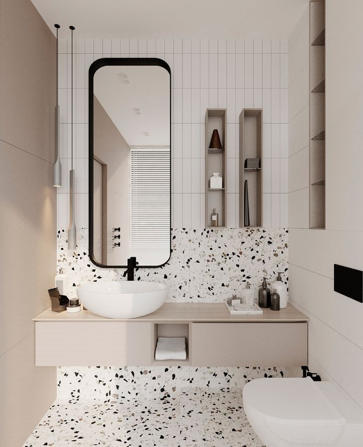 Modern bathroom design with terrazzo tiles, floating vanity, and minimalist fixtures.