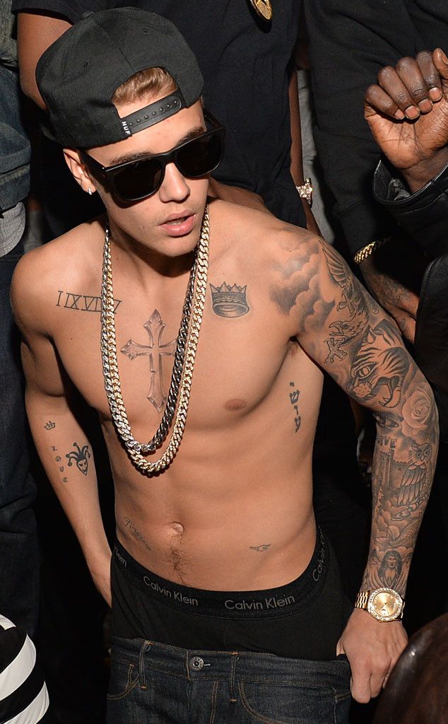 145e72e1976ecf5a908c0f30040a46cd Young man wearing sunglasses, a backward cap, no shirt, and showcasing tattoos while attending an event. | Sky Rye Design Young man wearing sunglasses, a backward cap, no shirt, and showcasing tattoos while attending an event.