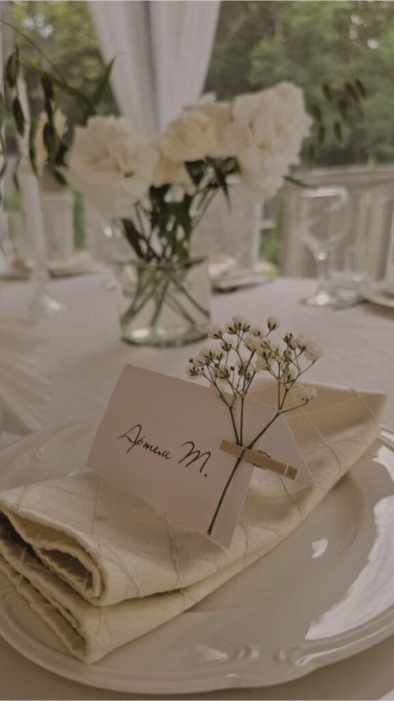 _ 15 Elegant table setting with a folded napkin, personalized name card, and delicate flowers, ideal for weddings or formal events. | Sky Rye Design Elegant table setting with a folded napkin, personalized name card, and delicate flowers, ideal for weddings or formal events.