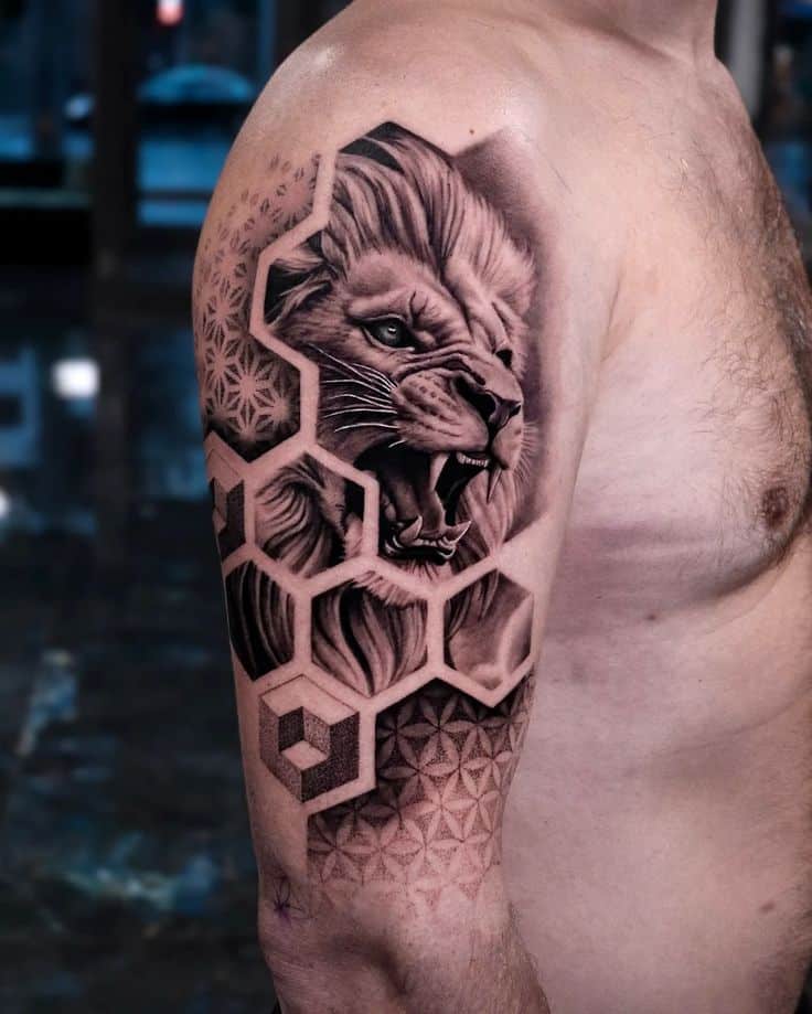 16 Unique Geometric Tattoo Ideas for Timeless_ Lion tattoo with geometric patterns on a man's upper arm, blending realism and abstract art. | Sky Rye Design Lion tattoo with geometric patterns on a man's upper arm, blending realism and abstract art.