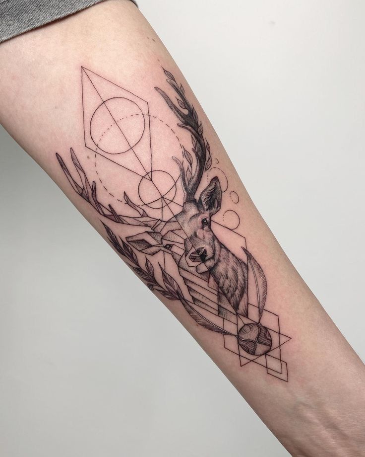 _ 17 Geometric deer tattoo with intricate lines and shapes on forearm, black ink design. | Sky Rye Design Geometric deer tattoo with intricate lines and shapes on forearm, black ink design.