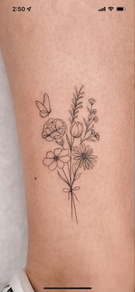 1976d9fcea2ec8f9638694f963d73e36 Minimalist floral tattoo: butterfly with delicate line-art flowers on skin, showcasing simple elegance. | Sky Rye Design Minimalist floral tattoo: butterfly with delicate line-art flowers on skin, showcasing simple elegance.
