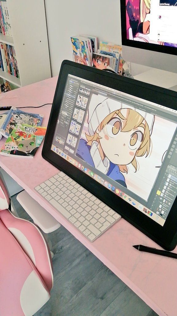 1cda833d-717c-4469-96a4-e9a12b5385c1 Digital art workspace featuring a Cintiq tablet with anime drawing, surrounded by manga books and a cozy pink chair. | Sky Rye Design Digital art workspace featuring a Cintiq tablet with anime drawing, surrounded by manga books and a cozy pink chair.