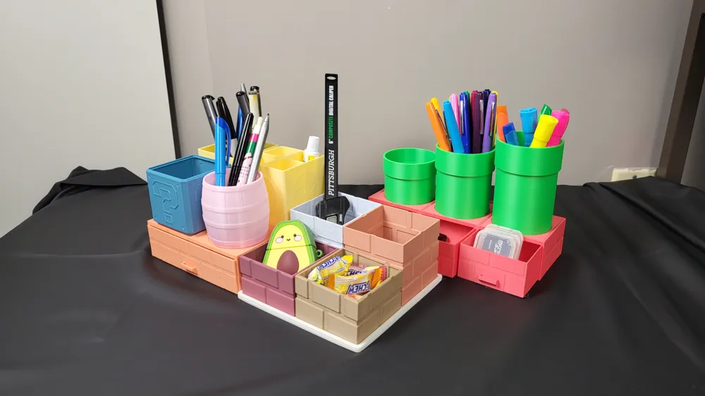 Colorful desk organizers holding pens, pencils, markers, and office supplies on a black surface, featuring creative, multi-level design.