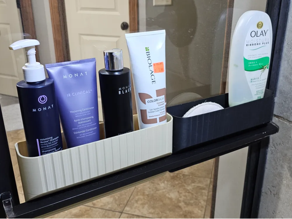 Shower shelf with various hair and body care products, including shampoo, conditioner, and body wash, neatly organized for easy access.
