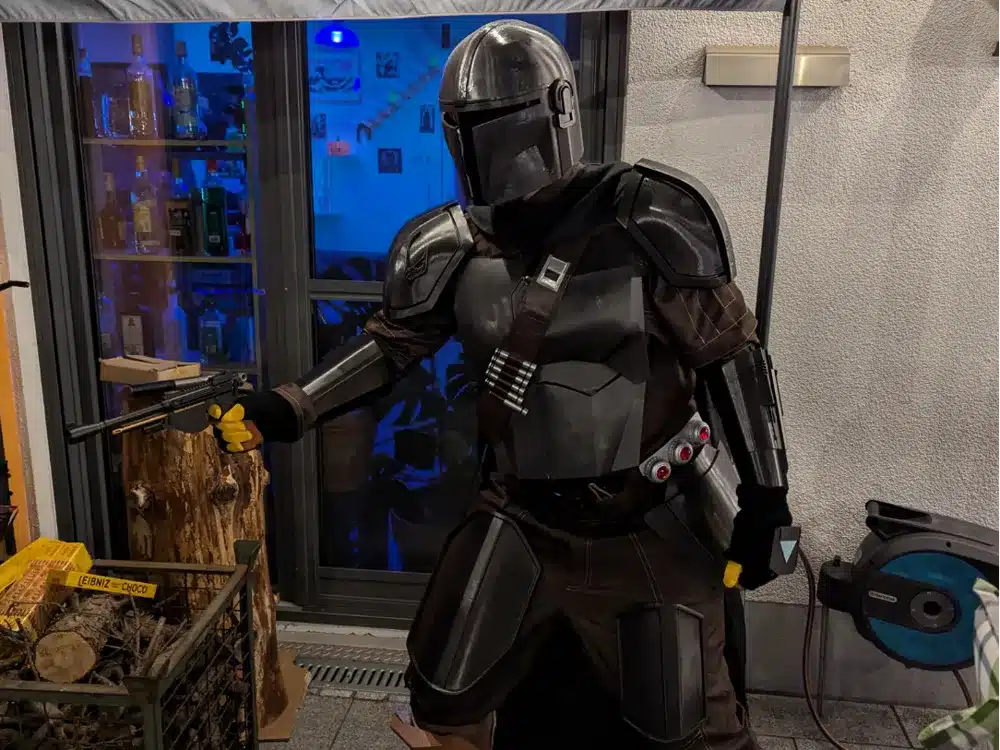 2025-01-08_4c2a92678fc1 Sci-fi character in armor holding a weapon indoors with blue-lit background, bottles, and wood stack visible nearby. | Sky Rye Design Sci-fi character in armor holding a weapon indoors with blue-lit background, bottles, and wood stack visible nearby.