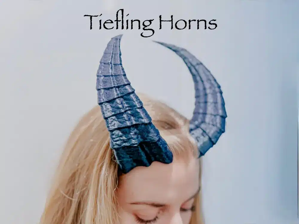 Blue tiefling horns costume accessory worn by person, showcasing a fantasy-inspired look against a light background.