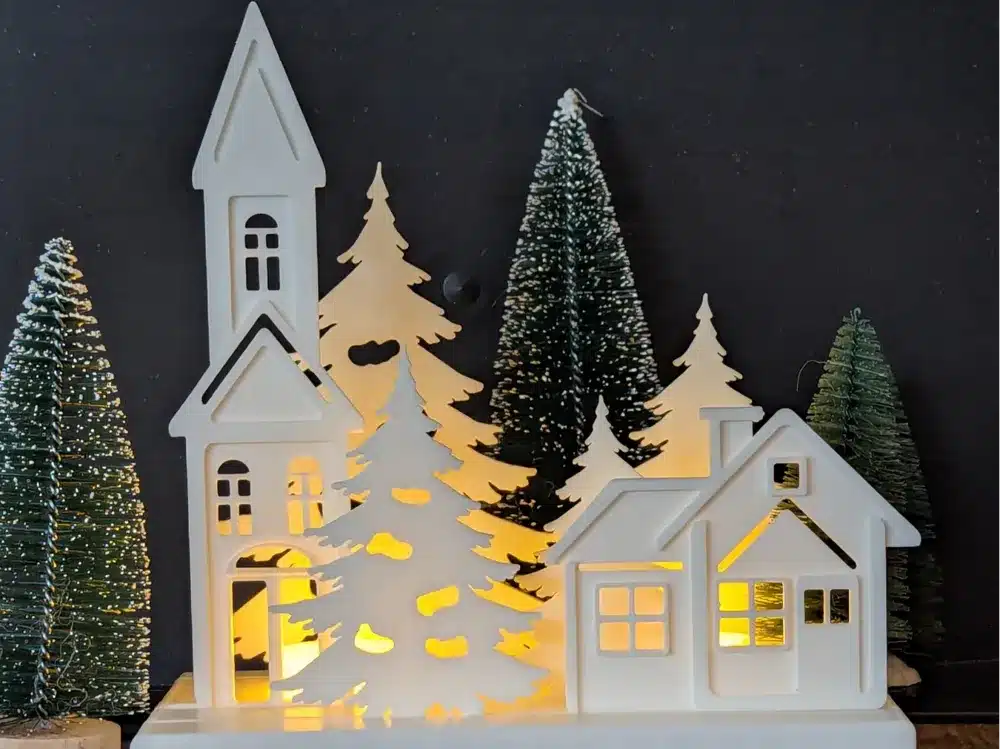 2025-10-17_7a776ee82011b8 Festive Christmas village scene with illuminated houses and evergreen trees, creating a cozy holiday atmosphere. | Sky Rye Design Festive Christmas village scene with illuminated houses and evergreen trees, creating a cozy holiday atmosphere.