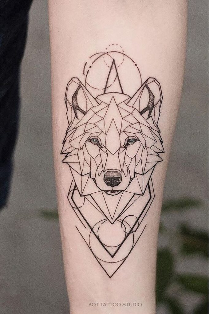 _ 23 Geometric wolf tattoo design on forearm, featuring intricate lines and shapes in black ink. | Sky Rye Design Geometric wolf tattoo design on forearm, featuring intricate lines and shapes in black ink.