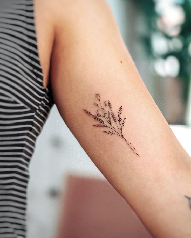 25a17d445fc0a7b4f5ca7def3e72c9de Floral tattoo on arm featuring delicate fine line design with leaves and flowers, perfect for minimalist body art lovers. | Sky Rye Design Floral tattoo on arm featuring delicate fine line design with leaves and flowers, perfect for minimalist body art lovers.