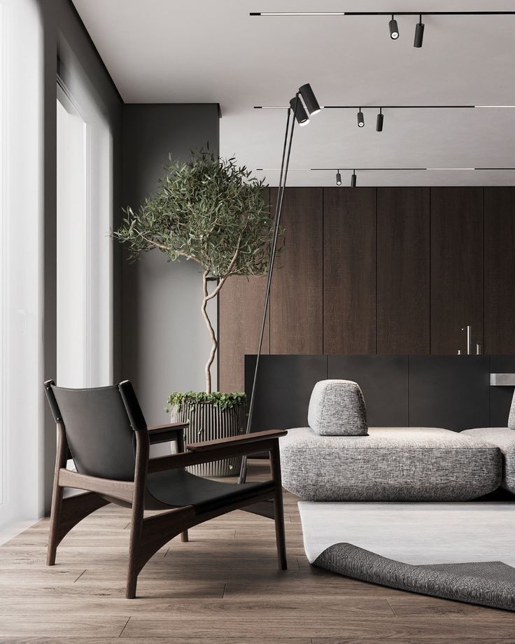 _ 30 Modern living room with sleek armchair, cozy sofa, large window, and indoor tree for stylish interior design. | Sky Rye Design Modern living room with sleek armchair, cozy sofa, large window, and indoor tree for stylish interior design. home design
