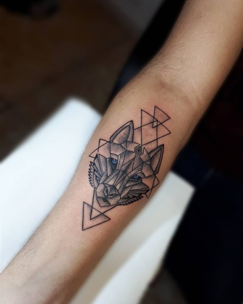 3608288d1a45e7c3173fdf62c3f6e936 Geometric wolf tattoo on forearm blending symmetry and art with intricate design work. | Sky Rye Design Geometric wolf tattoo on forearm blending symmetry and art with intricate design work.