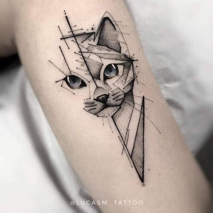 _ 4 Geometric cat tattoo design on arm with blue eyes and abstract shapes. | Sky Rye Design Geometric cat tattoo design on arm with blue eyes and abstract shapes.
