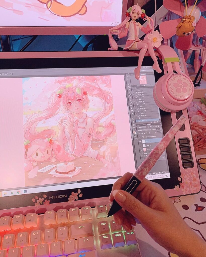 Digital art creation on pink-themed graphics tablet, featuring anime character design. Hand with stylus near colorful keyboard.