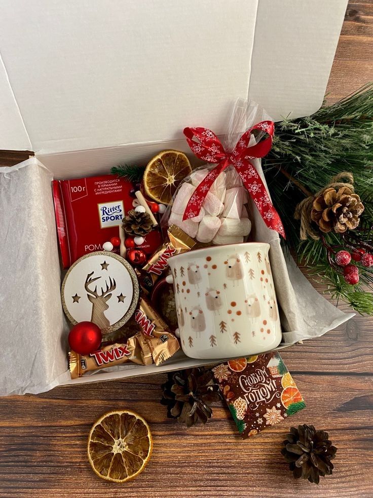 47e9a81f-c664-44d2-a0d5-1d8c35f6a091 Festive gift box with a mug, chocolates, dried oranges, and holiday décor, perfect for a cozy Christmas celebration. | Sky Rye Design Festive gift box with a mug, chocolates, dried oranges, and holiday décor, perfect for a cozy Christmas celebration.
