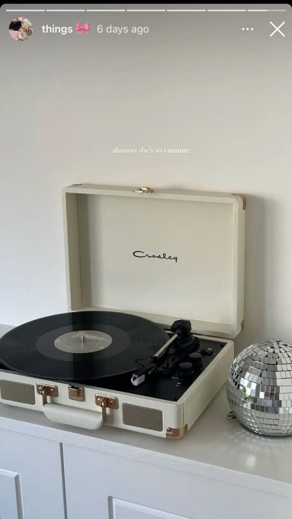 _ 49 Vintage turntable with vinyl record and disco ball on a white cabinet, exuding retro vibes and stylish decor. | Sky Rye Design Vintage turntable with vinyl record and disco ball on a white cabinet, exuding retro vibes and stylish decor.