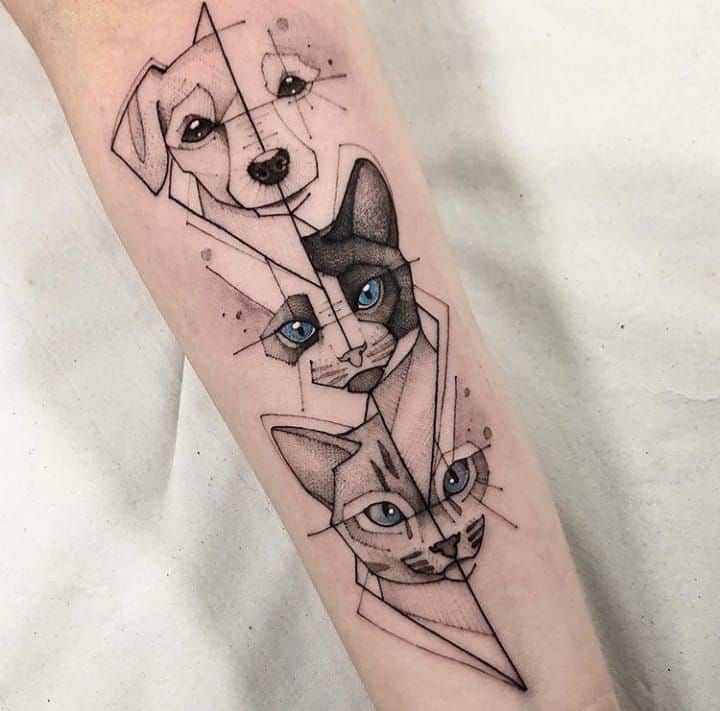 _ 5 Geometric tattoo featuring a dog and two cats with blue eyes on a forearm. | Sky Rye Design Geometric tattoo featuring a dog and two cats with blue eyes on a forearm.