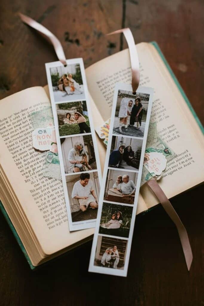 50 DIY Bookmarks Easy To Make Photo strip bookmarks on an open book, featuring family memories, enhanced with pink ribbons and delicate paper accents. | Sky Rye Design Photo strip bookmarks on an open book, featuring family memories, enhanced with pink ribbons and delicate paper accents.