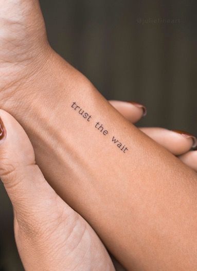 50+ Gorgeous Small Tattoo Ideas - Days Inspired Minimalist tattoo on forearm with the quote trust the wait, symbolizing patience and faith. | Sky Rye Design Minimalist tattoo on forearm with the quote trust the wait, symbolizing patience and faith.
