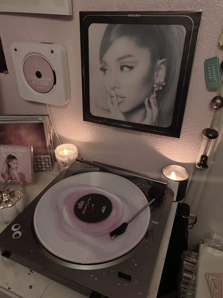 _ 51 Cozy room with a record player spinning a pastel vinyl, surrounded by candles, album covers, and a mounted CD player on the wall. | Sky Rye Design Cozy room with a record player spinning a pastel vinyl, surrounded by candles, album covers, and a mounted CD player on the wall.