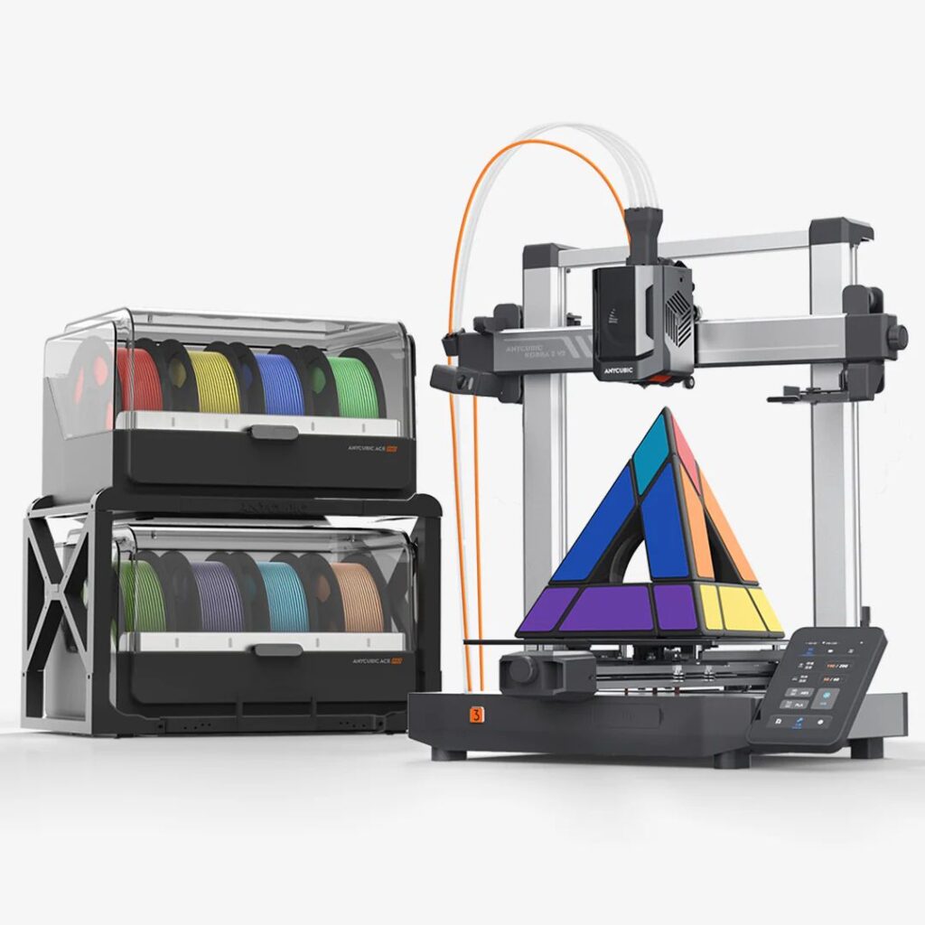 3D printer with filament spools and colorful geometric object, showcasing modern printing technology.