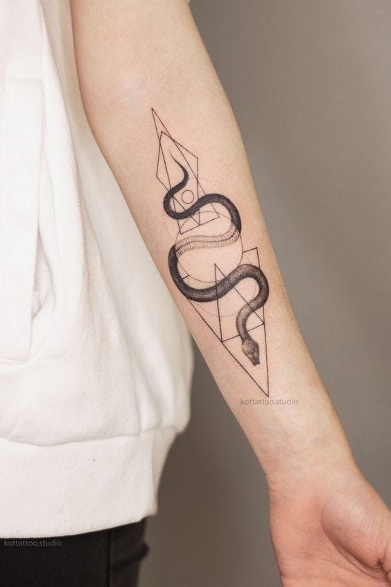 Geometric snake tattoo on forearm, featuring intricate linework within a triangular design.