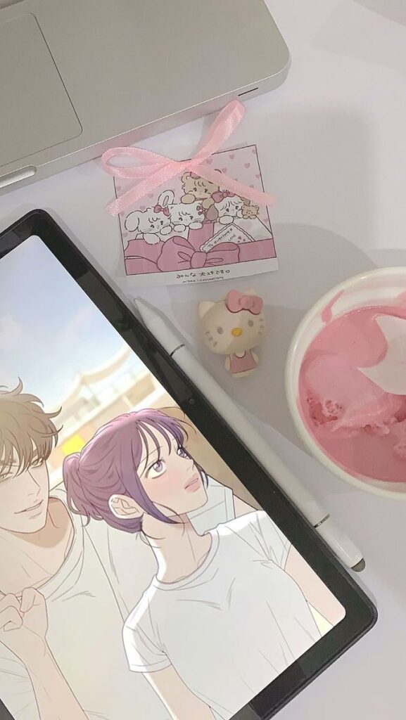 5832162e-4b90-4786-a13b-93d01cffef54 Tablet with digital art of a couple, a laptop, pink ice cream, and cute stationery; cozy and creative workspace setup. | Sky Rye Design Tablet with digital art of a couple, a laptop, pink ice cream, and cute stationery; cozy and creative workspace setup.