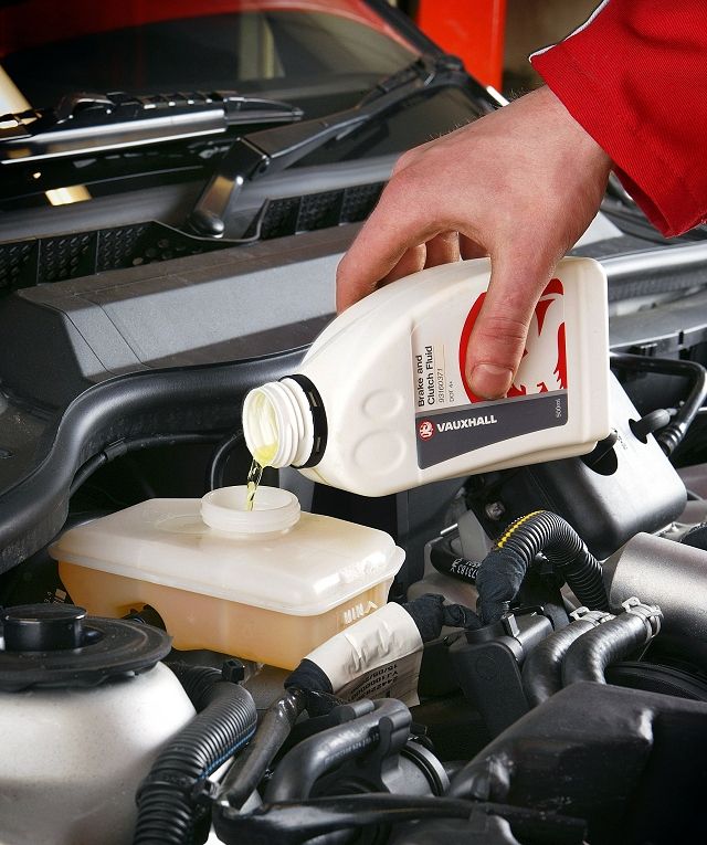 70e2dad6468b62cf14db79e932f520fe Pouring Vauxhall brake and clutch fluid into a car engine for maintenance. Ensure optimal vehicle performance with regular fluid checks. | Sky Rye Design Pouring Vauxhall brake and clutch fluid into a car engine for maintenance. Ensure optimal vehicle performance with regular fluid checks.
