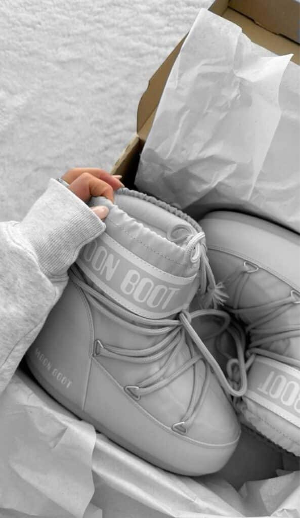 Gray Moon Boots in a box with tissue paper, ready for winter adventures.